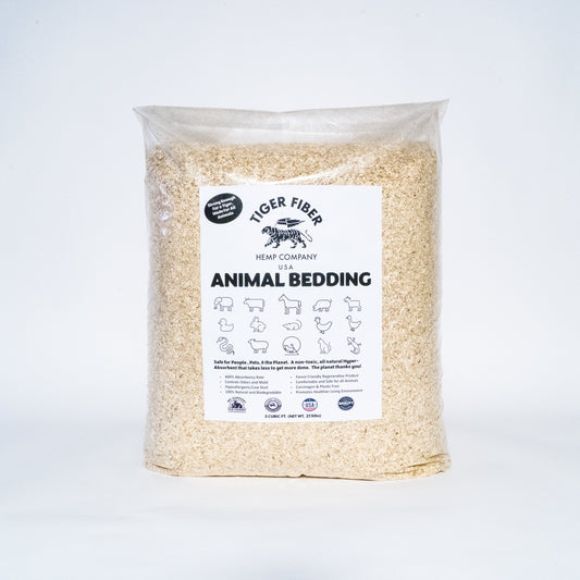 A 27.5 pound bag of made in USA animal bedding by Tiger Fiber hemp displayed over a white backdrop.